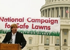 A man speaks from a podium at a rally