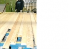 Photo of a man with planks of wood