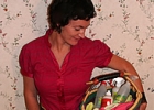 Keri Leeb holding a basket of cleaning supplies