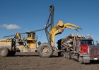 Photo of a machine moving logs