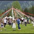 People dancing around a maypole