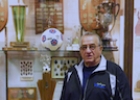 A man standing in front of a trophy case.