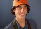 man with a camera wearing a hat