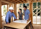 People standing in a house under construction