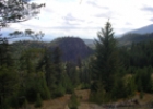 A scenic view with trees and rolling hills.