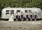 bridal party standing in front of a trailer