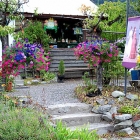 Garden Graces, front of building with flowersaroundthe entrance