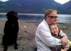 Chris Holland with his daughter and dog at the beach