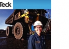 Photo of a person beside a coal truck
