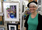 Nicole Leblond standing beside a painting