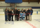 Two young hockey players cut ribbon in hockey arena