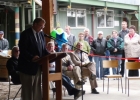 A man speaking behind a podium