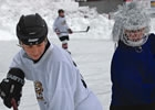 two people playing hockey