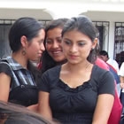 Student nurses demonstrate how to use condoms with a wooden baton and a condom for the Sipikapense Indigenous group.