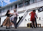 People dancing on the boat's deck