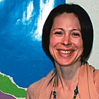 lady standing in front of a child care sign