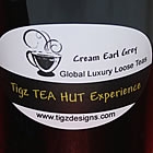 tea container with loose leaf tea beside it