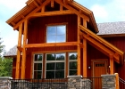 Exterior photo of a house with large windows