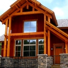 Exterior photo of a house with large windows