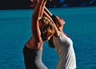 two women doing yoga