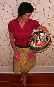 Keri Leeb holding a basket of cleaning supplies