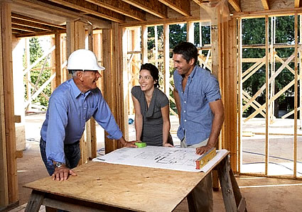 People standing in a house under construction