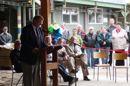 A man speaking behind a podium