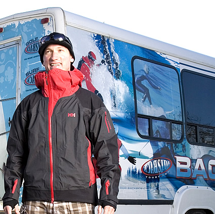 Tod Caton standing in front of a tour bus