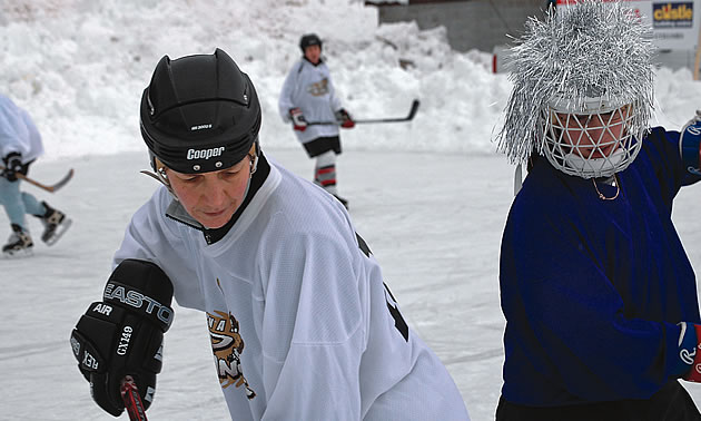 two people playing hockey