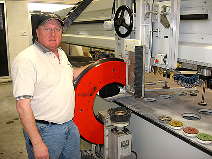 Man standing by granite slab