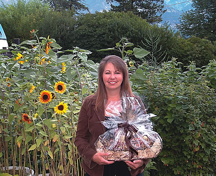 Jayne Magri holding a gift basket