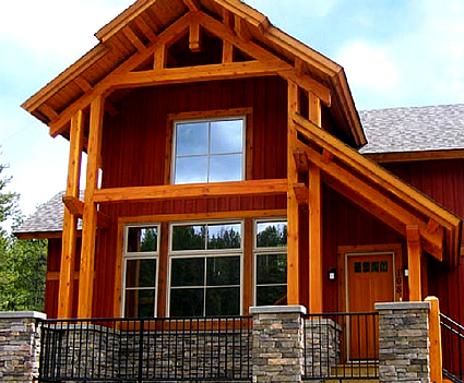 Exterior photo of a house with large windows