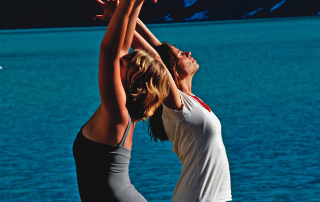 two women doing yoga